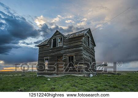 Abandoned house on the prairies with storm clouds overhead at sunset; Val Marie, Saskatchewan, Canada View Large Photo Image Stock Photograph - Abandoned house on the prairies with storm clouds overhead at sunset; Val Marie, Saskatchewan, Canada. Fotosearch