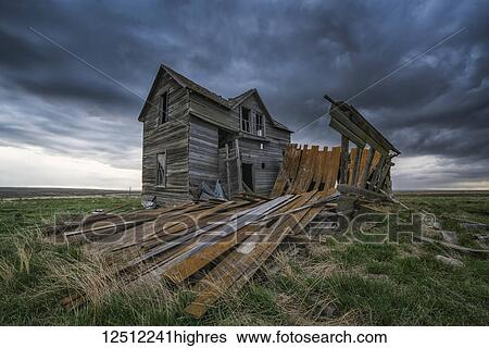 Abandoned house on the prairies with storm clouds overhead at sunset; Val Marie, Saskatchewan, Canada View Large Photo Image Stock Photograph - Abandoned house on the prairies with storm clouds overhead at sunset; Val Marie, Saskatchewan, Canada. Fotosearch