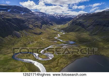 Aerial view of the river winding its way to the ocean in Iceland's West Fjords; Iceland View Large Photo Image Stock Photograph - Aerial view of the river winding its way to the ocean in Iceland's West Fjords; Iceland. Fotosearch