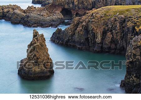 Amazing scenery along a remote section of the West Fjords with great autumn colours and a sea stack in the ocean; West Fjords, Iceland View Large Photo Image Stock Photograph - Amazing scenery along a remote section of the West Fjords with great autumn colours and a sea stack in the ocean; West Fjords, Iceland. Fotosearch