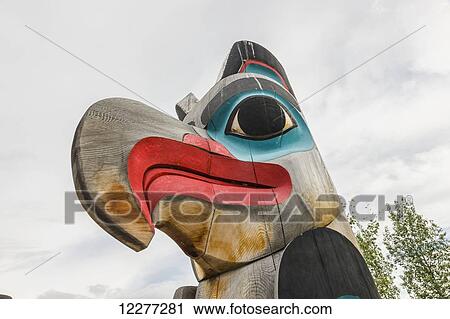 An eagle head carved atop a totem pole, Yukon Territory, Canada, Summer View Large Photo Image Stock Image - An eagle head carved atop a totem pole, Yukon Territory, Canada, Summer. Fotosearch