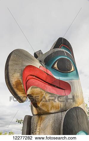 An eagle head carved atop a totem pole, Yukon Territory, Canada, Summer View Large Photo Image Stock Image - An eagle head carved atop a totem pole, Yukon Territory, Canada, Summer. Fotosearch