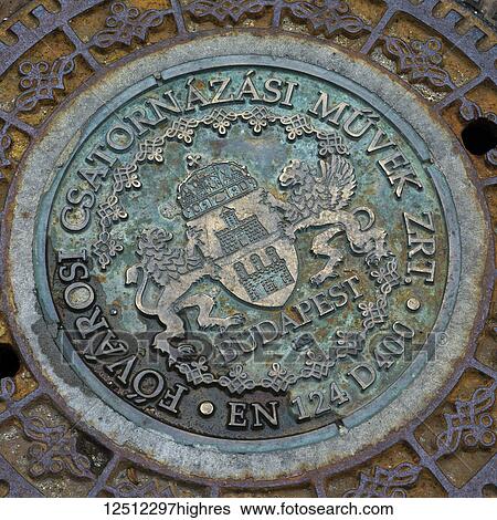An emblem for Budapest on a metal manhole cover in Buda's Castle District; Buda, Budapest, Hungary View Large Photo Image Stock Photograph - An emblem for Budapest on a metal manhole cover in Buda's Castle District; Buda, Budapest, Hungary. Fotosearch