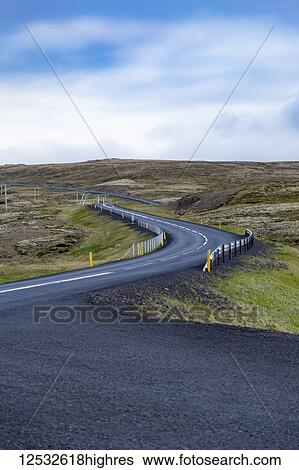 An empty road winds through the rugged landscape hills; Iceland View Large Photo Image Stock Photograph - An empty road winds through the rugged landscape hills; Iceland. Fotosearch