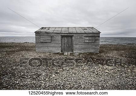 Stock Photograph - An old fishing house on the Atlantic shores; Bear Cove, Newfoundland and Labrador, Canada. Fotosearch