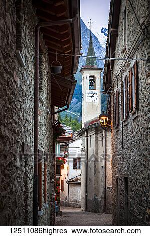Ancient cobblestone streets lead to a church, Dolonne, near Courmayeur; Aosta Valley, Italy View Large Photo Image Stock Photograph - Ancient cobblestone streets lead to a church, Dolonne, near Courmayeur; Aosta Valley, Italy. Fotosearch