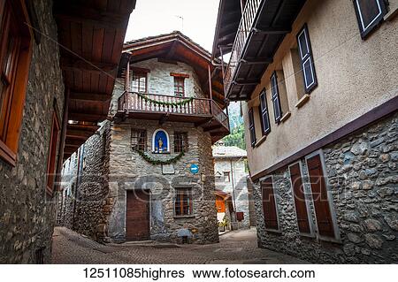 Stock Photograph - Ancient cobblestone streets of Dolonne, near Courmayeur; Aosta Valley, Italy. Fotosearch