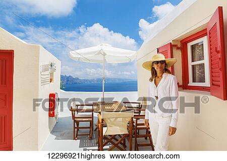 Stock Photograph - Attractive Female Tourist Relaxing On Vacation On Mediterranean Island. Fotosearch