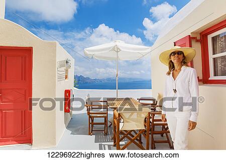Attractive Female Tourist Relaxing On Vacation On Mediterranean Island View Large Photo Image Stock Photograph - Attractive Female Tourist Relaxing On Vacation On Mediterranean Island. Fotosearch