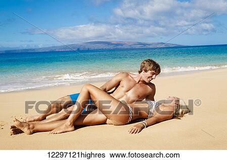 Stock Photograph - Attractive Young Couple On Tropical Beach. Fotosearch