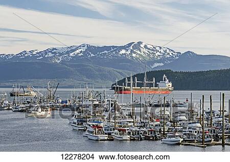Auke Bay small boat harbor north of Juneau with Admiralty Island and Mansfield Peninsula in the background, Southeast Alaska View Large Photo Image Picture - Auke Bay small boat harbor north of Juneau with Admiralty Island and Mansfield Peninsula in the background, Southeast Alaska. Fotosearch