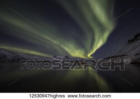 Stock Photograph - Aurora Borealis, or Northern lights; Djupavik, West Fjords, Iceland. Fotosearch
