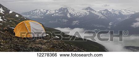 Backpacker tent with rain fly overlooking Alaskan fjord from mountain top; Skagway, Alaska, United States of America View Large Photo Image Stock Photograph - Backpacker tent with rain fly overlooking Alaskan fjord from mountain top; Skagway, Alaska, United States of America. Fotosearch