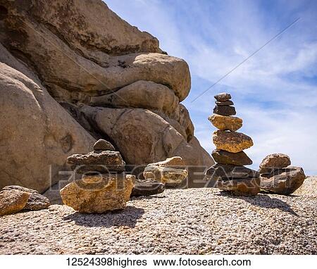 Stock Photograph - Balancing rock towers built by tourists in Joshua Tree National Park; California, United States of America. Fotosearch
