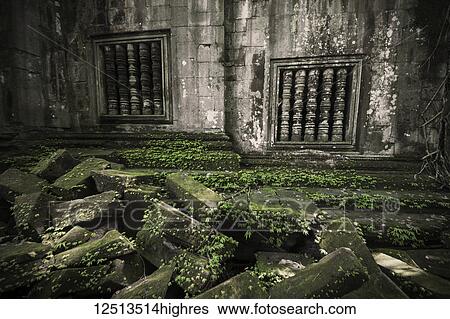 Stock Photograph - Balustraded windows at the ruins of Beng Meala; Siem Reap, Cambodia. Fotosearch