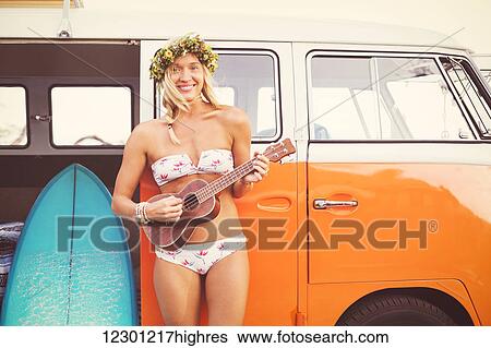 Beach Lifestyle, Beautiful Surfer Girl With Ukulele And Classic Vintage Surf Van On The Beach At Sunset View Large Photo Image Stock Photograph - Beach Lifestyle, Beautiful Surfer Girl With Ukulele And Classic Vintage Surf Van On The Beach At Sunset. Fotosearch