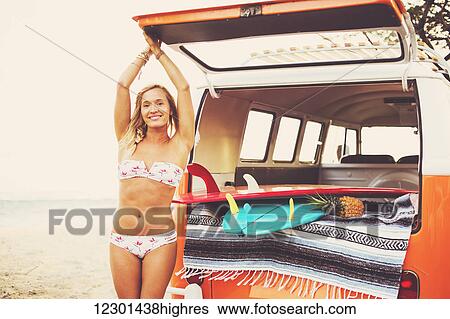Beach Lifestyle, Beautiful Surfer Girl On The Beach At Sunset With Classic Vintage Surf Van View Large Photo Image Stock Photograph - Beach Lifestyle, Beautiful Surfer Girl On The Beach At Sunset With Classic Vintage Surf Van. Fotosearch