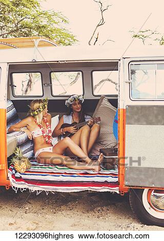 Beach Lifestyle. Beautiful Young Surfer Girls Having Fun Hanging Out In Vintage Surf Van. Best Friends. View Large Photo Image Stock Photograph - Beach Lifestyle. Beautiful Young Surfer Girls Having Fun Hanging Out In Vintage Surf Van. Best Friends.. Fotosearch