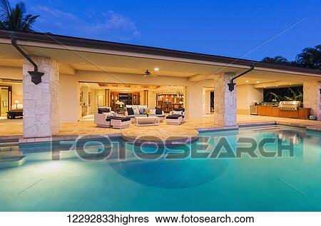 Beautiful Luxury Home With Swimming Pool At Sunset View Large Photo Image Stock Photograph - Beautiful Luxury Home With Swimming Pool At Sunset. Fotosearch