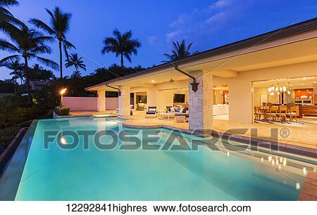 Beautiful Luxury Home With Swimming Pool At Sunset View Large Photo Image Stock Photograph - Beautiful Luxury Home With Swimming Pool At Sunset. Fotosearch