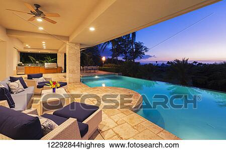 Beautiful Luxury Home With Swimming Pool At Sunset View Large Photo Image Stock Photograph - Beautiful Luxury Home With Swimming Pool At Sunset. Fotosearch