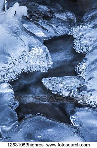 Beautiful patterns of ice are formed when water continues running as a stream freezes up; Djupavik, West Fjords, Iceland View Large Photo Image Stock Photograph - Beautiful patterns of ice are formed when water continues running as a stream freezes up; Djupavik, West Fjords, Iceland. Fotosearch