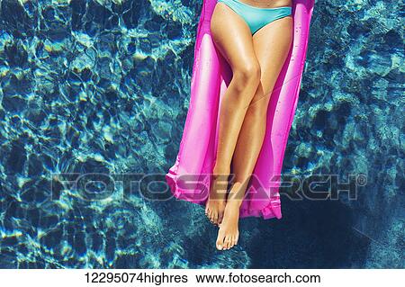 Beautiful Sexy Young Woman Relaxing Floating On Raft In Luxury Swimming Pool View Large Photo Image Stock Photograph - Beautiful Sexy Young Woman Relaxing Floating On Raft In Luxury Swimming Pool. Fotosearch