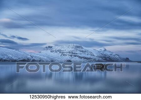Beautiful sunset blue light over the fjord near Djupavik; West Fjords, Iceland View Large Photo Image Stock Photograph - Beautiful sunset blue light over the fjord near Djupavik; West Fjords, Iceland. Fotosearch