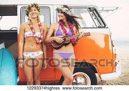 Beautiful Surfer Girls With Ukulele And Flower Leis Hanging Out On The Beach At Sunset With Classic Vintage Surf Van View Large Photo Image Stock Photograph - Beautiful Surfer Girls With Ukulele And Flower Leis Hanging Out On The Beach At Sunset With Classic Vintage Surf Van. Fotosearch