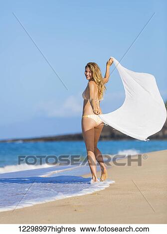 Stock Photograph - Beautiful Woman In Bikini With White Scarf On The Beach. Travel And Vacation.. Fotosearch