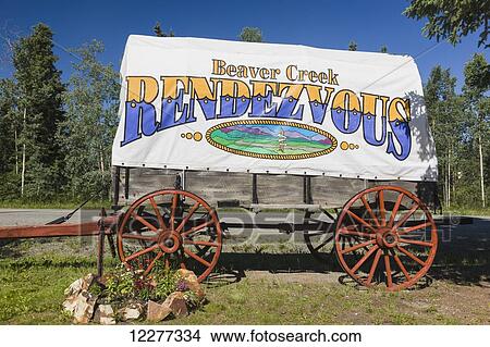 Beaver Creek Rendezvous sign on a historic wooden wagon, Beaver Creek, Northern Yukon Territory, Canada, Summer View Large Photo Image Picture - Beaver Creek Rendezvous sign on a historic wooden wagon, Beaver Creek, Northern Yukon Territory, Canada, Summer. Fotosearch