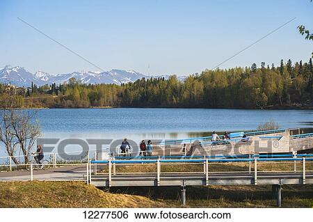 Bicyclist on the Tony Knowels Coastal Trail near Westchester Lagoon in Anchorage, Alaska, Spring. View Large Photo Image Stock Photograph - Bicyclist on the Tony Knowels Coastal Trail near Westchester Lagoon in Anchorage, Alaska, Spring.. Fotosearch