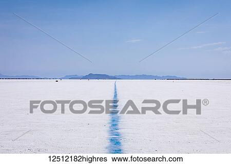 Stock Photograph - Blue line showing edge of track on Bonneville Speedway on Bonneville Salt Flats; Utah, United States of America. Fotosearch