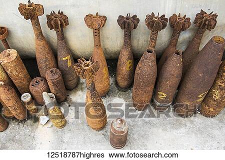 Stock Photograph - Bomb casings dating to the Indochina Wars; Phonsavan, Xiangkhouang, Laos. Fotosearch