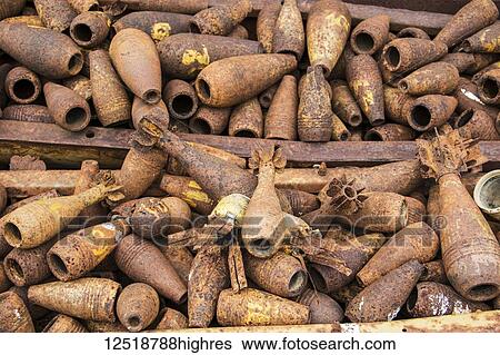 Stock Photograph - Bomb casings dating to the Indochina Wars; Phonsavan, Xiangkhouang, Laos. Fotosearch