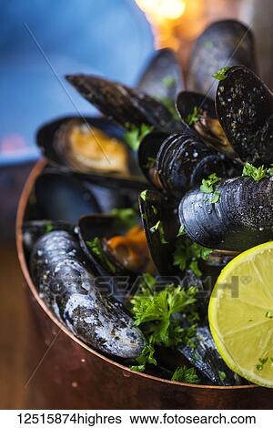 Stock Photograph - Bowl of mussels, Sjavarpakkhusid restaurant; Stykkisholmur, Iceland. Fotosearch