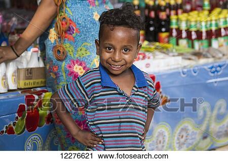 Boy at the market; Dili, East Timor View Large Photo Image Stock Image - Boy at the market; Dili, East Timor. Fotosearch