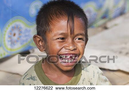 Boy at the market; Dili, East Timor View Large Photo Image Stock Image - Boy at the market; Dili, East Timor. Fotosearch