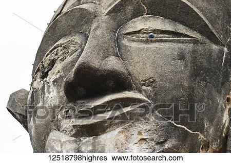 Stock Photograph - Buddha statue in the ruins of Wat Piawat temple, destroyed in the Indochina War; Muang Khoun, Xiangkhouang, Laos. Fotosearch