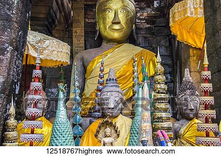 Stock Photograph - Buddha statues in the Main Sanctuary of the Vat Phou Temple Complex; Champasak, Laos. Fotosearch