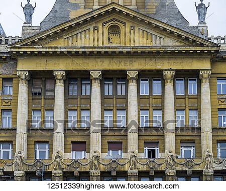 Building with weathered facade of columns and windows and decorative features; Budapest, Budapest, Hungary View Large Photo Image Stock Photograph - Building with weathered facade of columns and windows and decorative features; Budapest, Budapest, Hungary. Fotosearch