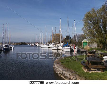 Canal with sailboats mooring; Exeter, Devon, England View Large Photo Image Stock Photograph - Canal with sailboats mooring; Exeter, Devon, England. Fotosearch