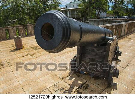 Stock Photograph - Cannon on display on site of Old Bath Hotel, now derelict; Nevis, West Indies. Fotosearch