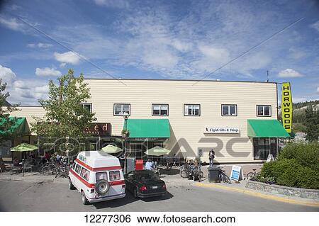 Cars and bicycles parked outside of shops and a cafe in downtown Whitehorse, Yukon Territory, Canada, Summer View Large Photo Image Stock Photograph - Cars and bicycles parked outside of shops and a cafe in downtown Whitehorse, Yukon Territory, Canada, Summer. Fotosearch