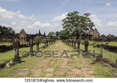 Stock Photograph - Causeway bordered by sandstone posts, Vat Phou Temple Complex; Champasak, Laos. Fotosearch