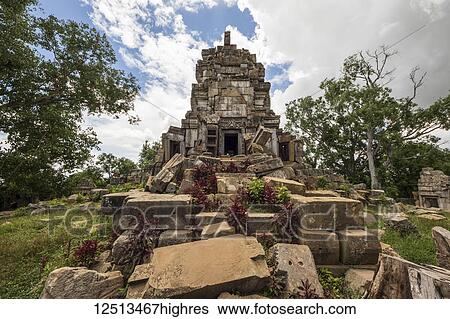 Stock Photograph - Central tower of the ancient Angkorian temple at Wat Ek Phnom; Battambang, Cambodia. Fotosearch