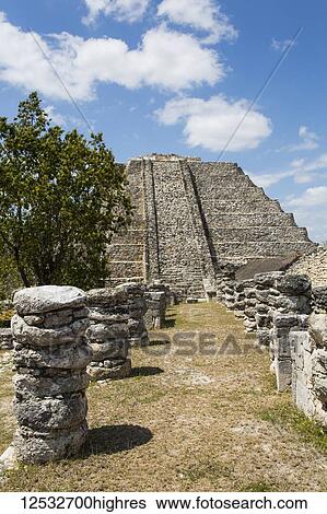 Stock Photograph - Chac Complex (foreground), Castle of Kululcan (background), Mayapan Archaeological Site, Mayan Ruins; Yucatan, Mexico. Fotosearch