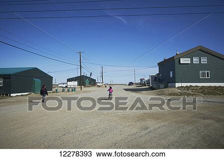 Child on bike on dirt road; Cambridge Bay, Victoria Island, Nunavut, Canada View Large Photo Image Stock Image - Child on bike on dirt road; Cambridge Bay, Victoria Island, Nunavut, Canada. Fotosearch