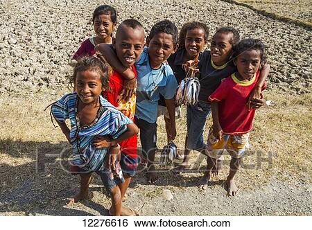Children selling fish, near Vemasse; Baucau, East Timor View Large Photo Image Stock Photograph - Children selling fish, near Vemasse; Baucau, East Timor. Fotosearch