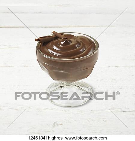 Stock Photograph - Chocolate pudding in a glass cup with chocolate shavings as a garnish. Fotosearch